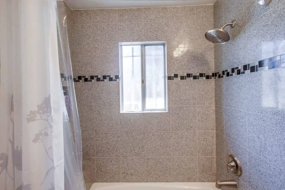 View of the shower from the hall bath