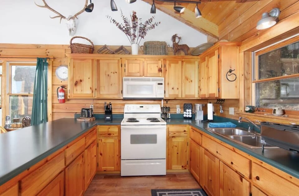 Fully stocked kitchen with everything you need for a comfortable stay.