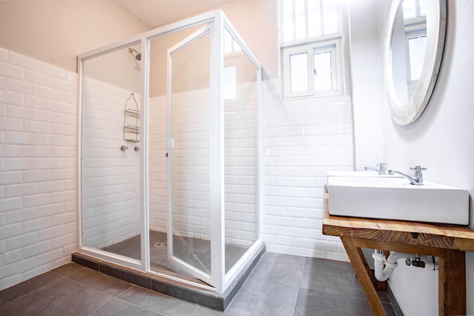 Unique Seafront Room | Bathroom | Shower, towels