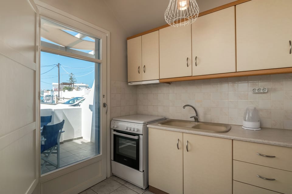Standard Apartment, 2 Bedrooms | Private kitchen | Fridge, stovetop, coffee/tea maker, electric kettle