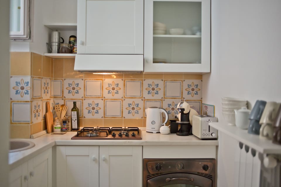 Shared fridge, electric kettle, cookware/dishes/utensils, dining tables