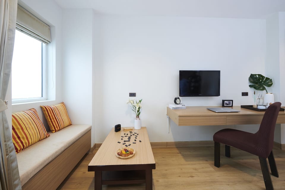 Deluxe Double Room, Balcony | Living area | 32-inch LCD TV with cable channels, TV