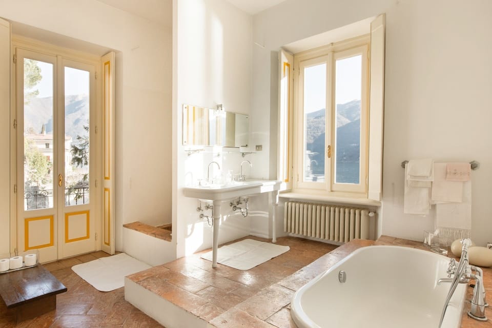 Suite, 1 Queen Bed, Lake View | Bathroom | Shower, free toiletries, hair dryer, bathrobes