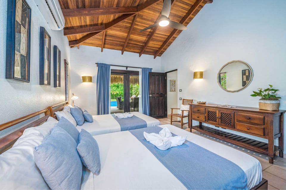 Second bedroom with two queen beds and pool view