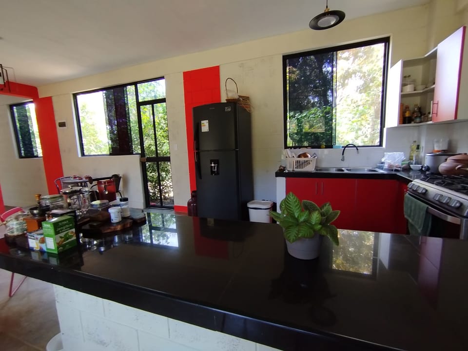 Full-size fridge, microwave, cookware/dishes/utensils