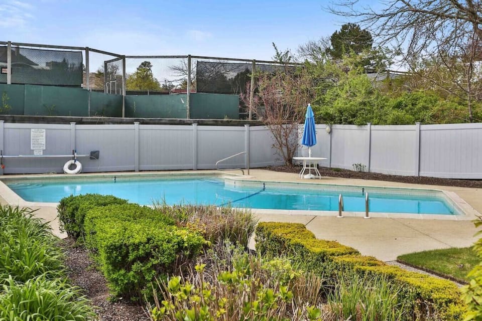 The pool is on the grounds and a 2-3 minute walk from the house on the way to the beach and next to the tennis courts.