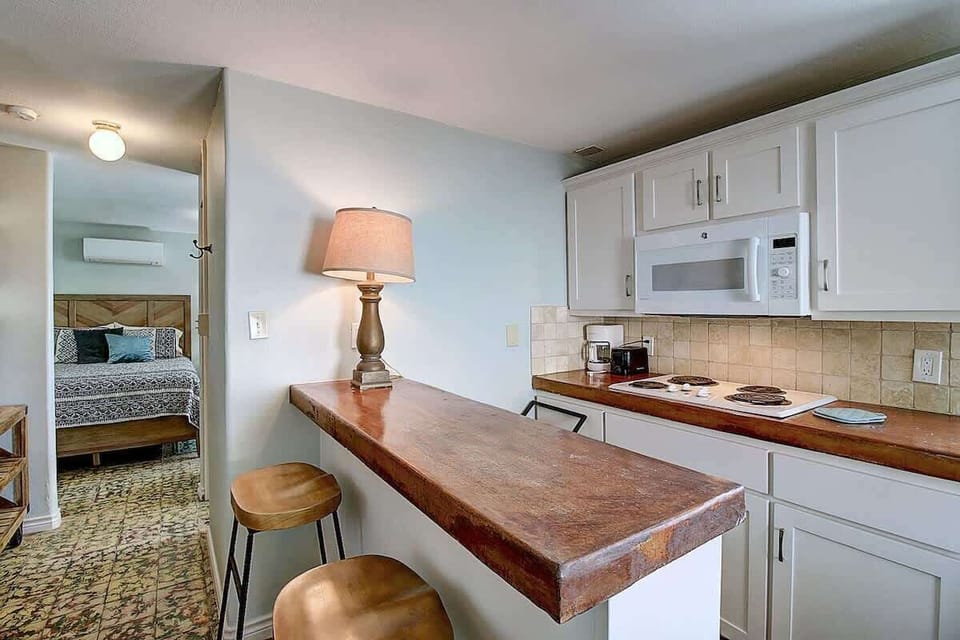 Fully stocked kitchen with a breakfast bar area