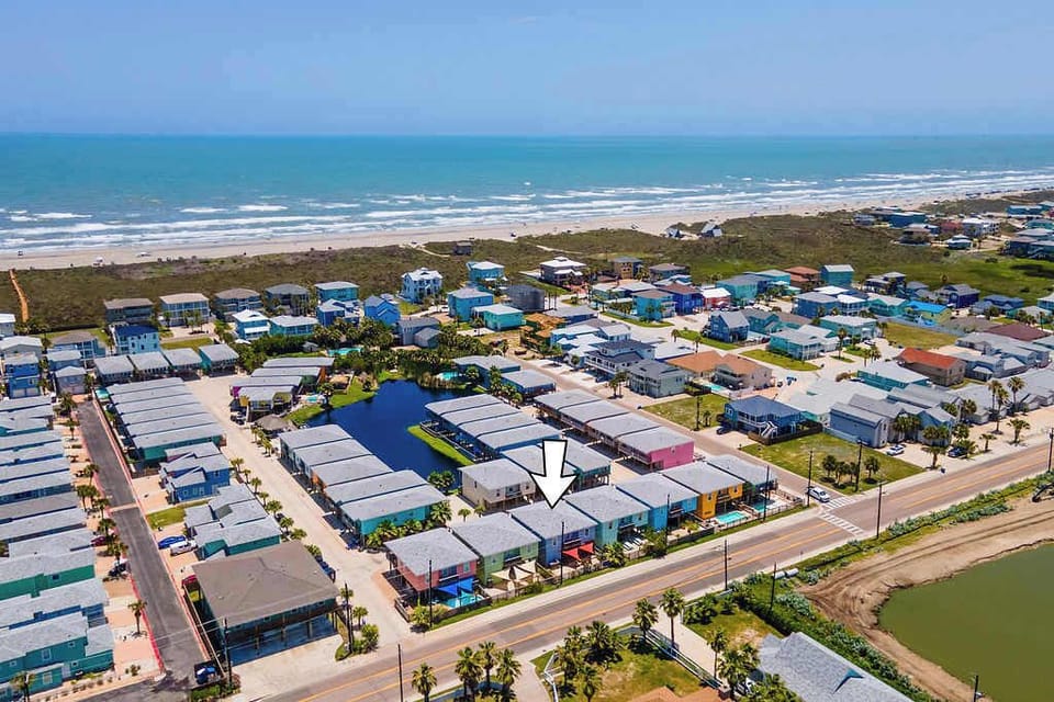 Stunning aerial views of your coastal retreat and the charming neighborhood, just minutes from the beach.
