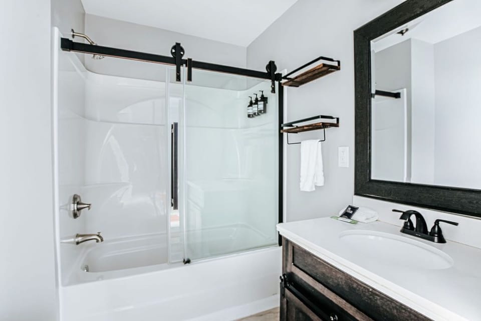 Downstairs bathroom with tub/shower combo. Towels and toiletries provided