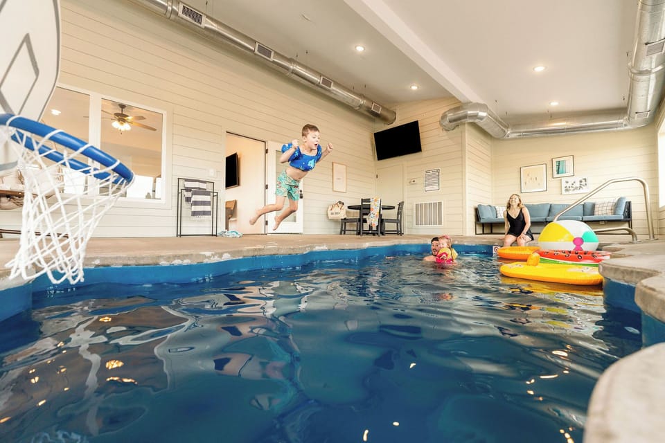 Swim, relax, and keep the game on with the TV in the indoor pool room.