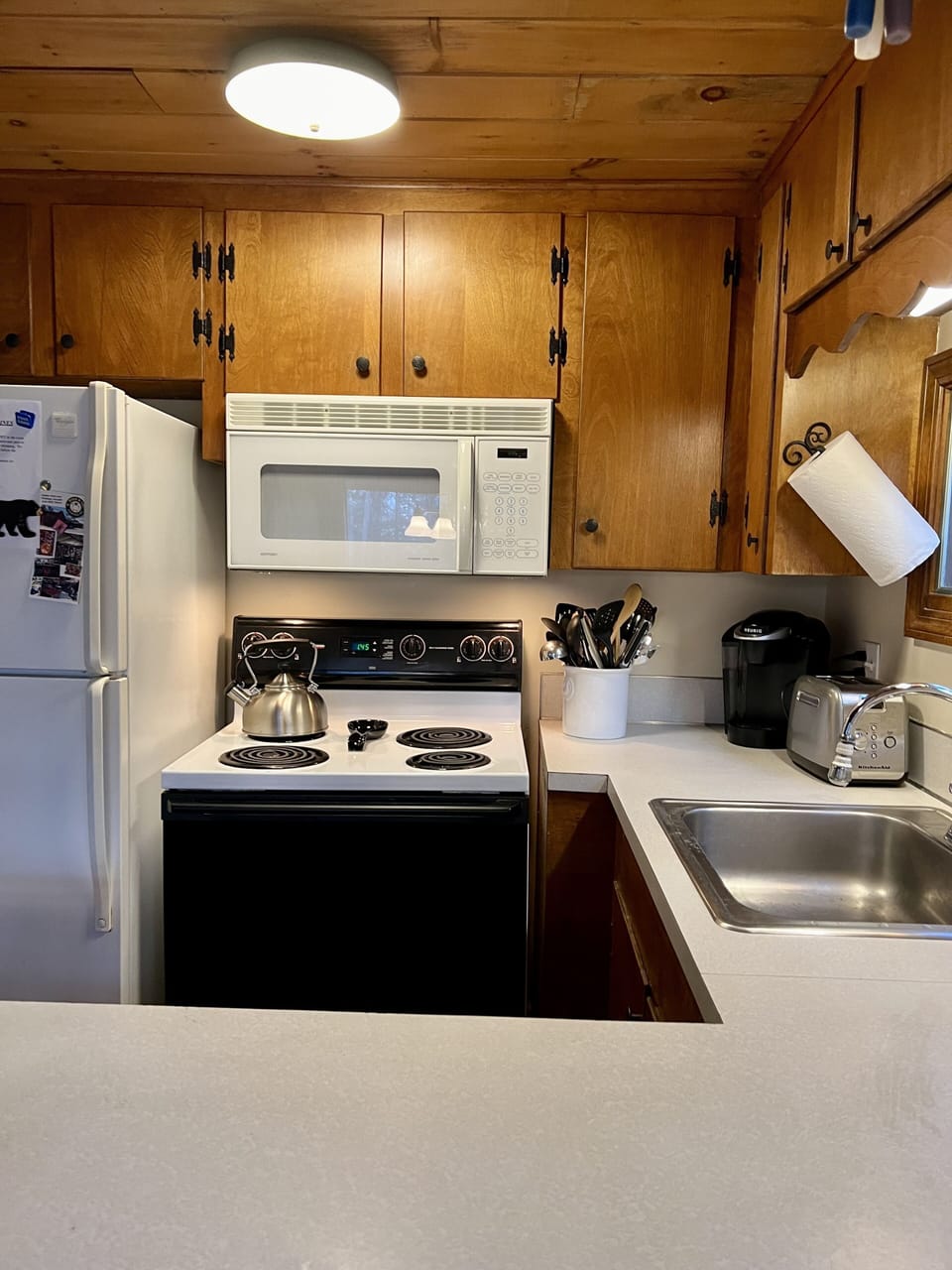 kitchen, wit 2 coffee makers, toaster, oven, pantry items, microwave