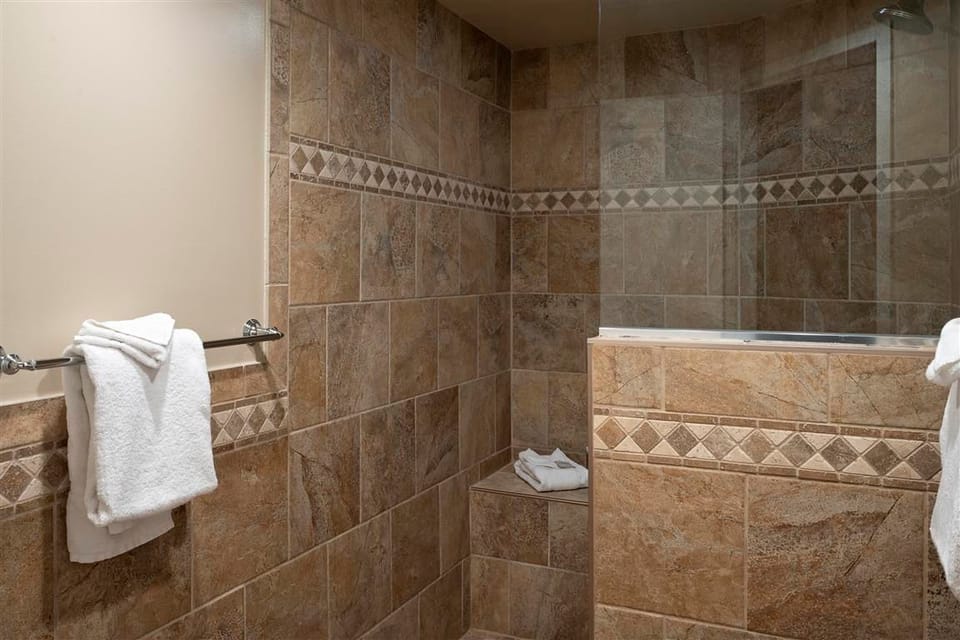 Rejuvenate in the spacious tiled shower.
