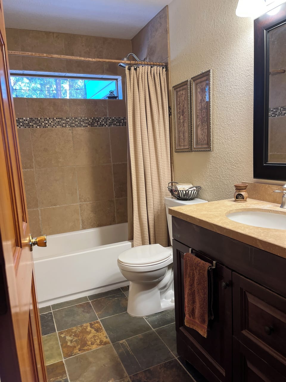 Main level full bathroom in close proximity to two bedrooms