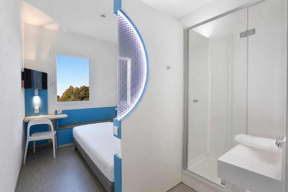 Premium bedding, desk, laptop workspace, blackout drapes
