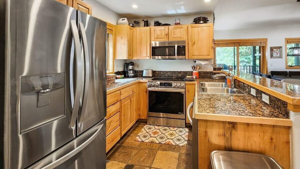 The fully equipped kitchen is set up with everything you need to prepare delicious meals during your stay.