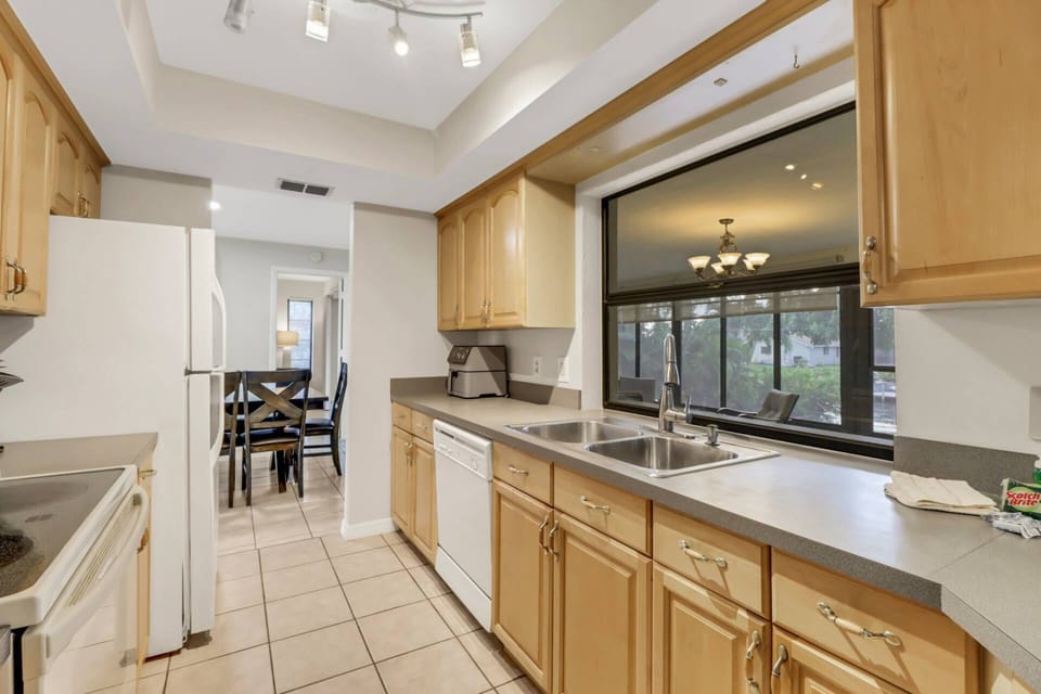 The galley style kitchen is equipped with full size appliances.
