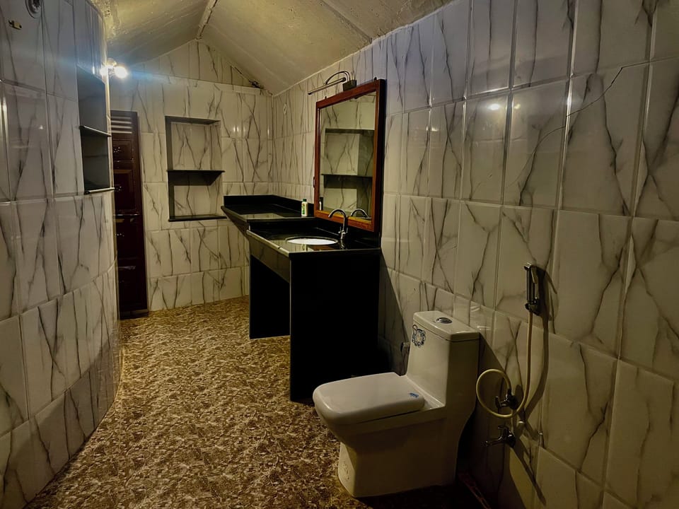 Shower, free toiletries, slippers, towels