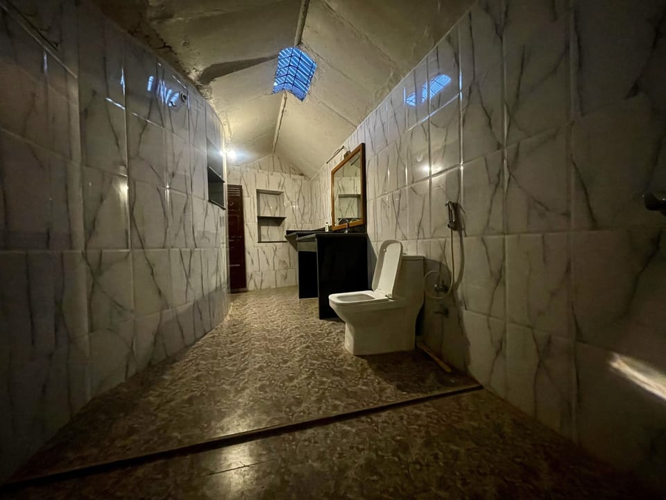 Shower, free toiletries, slippers, towels