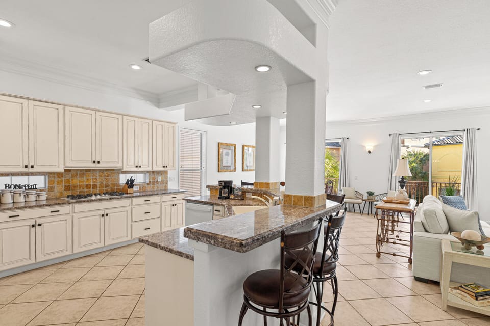 Your open-concept kitchen flows seamlessly into the living space, perfect for entertaining with granite counters and modern appliances.