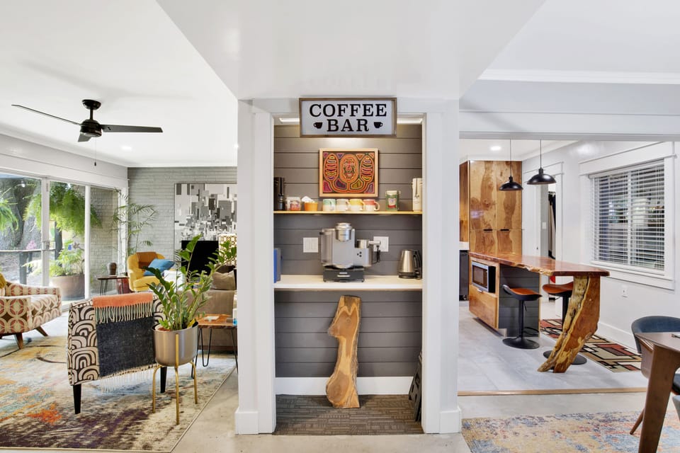 Well stocked coffee/tea bar between the living room and kitchen.