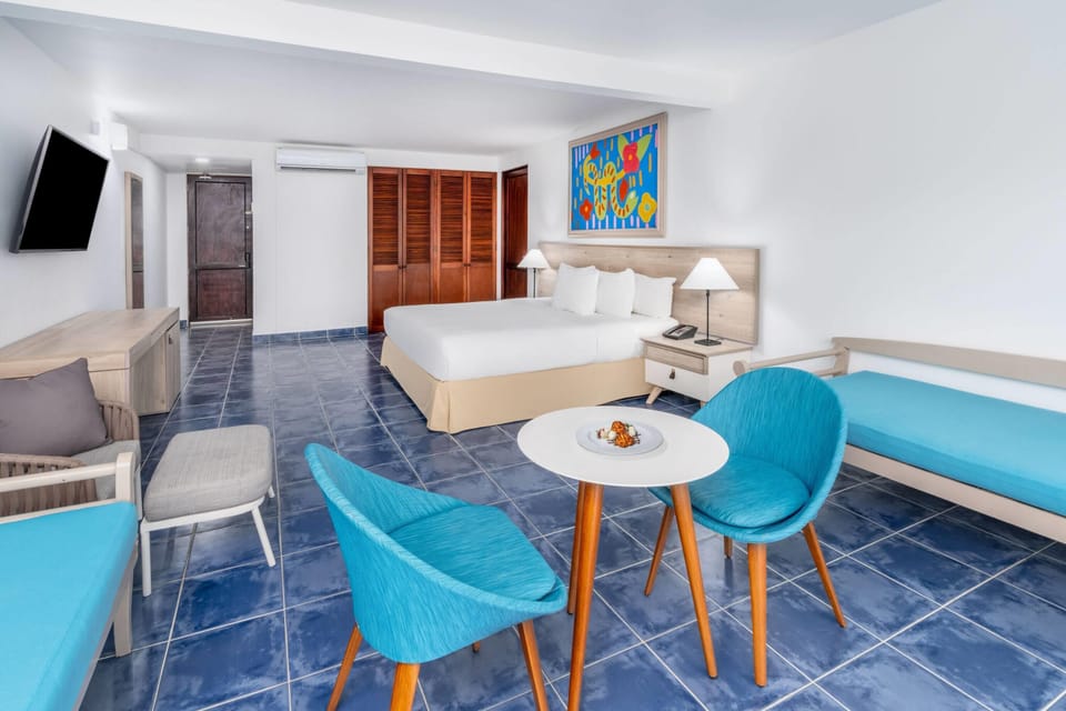Room, 1 King Bed, Ocean View (Plus) | Minibar, in-room safe, desk, iron/ironing board
