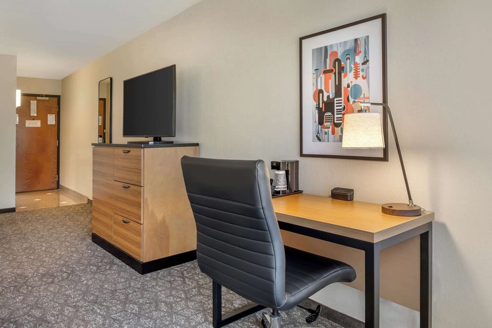 Desk, blackout drapes, iron/ironing board, free cribs/infant beds