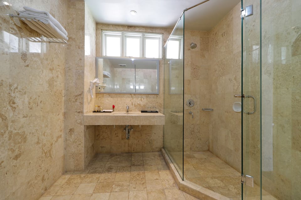 Shower, free toiletries, slippers, towels