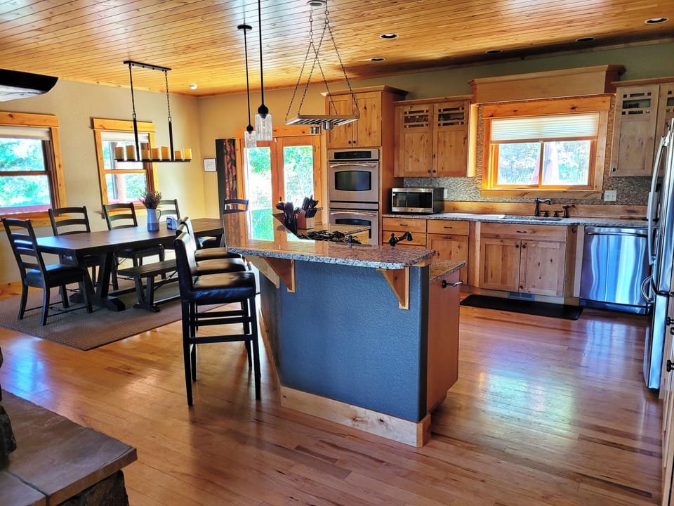Kitchen includes oven, stove, dishwasher, full size refrigerator,  microwave