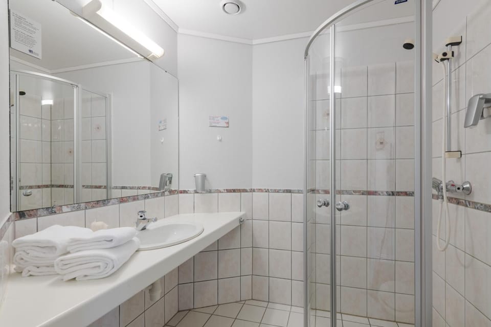 Eco-friendly toiletries, hair dryer, heated floors, towels