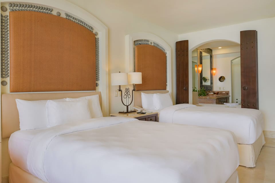 Premium bedding, pillowtop beds, minibar (free items), in-room safe