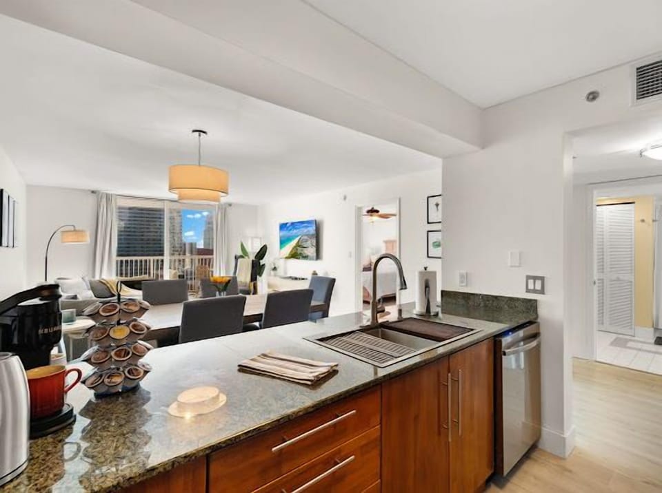 Newly remodeled stainless steel kitchen with chef’s prep sink.