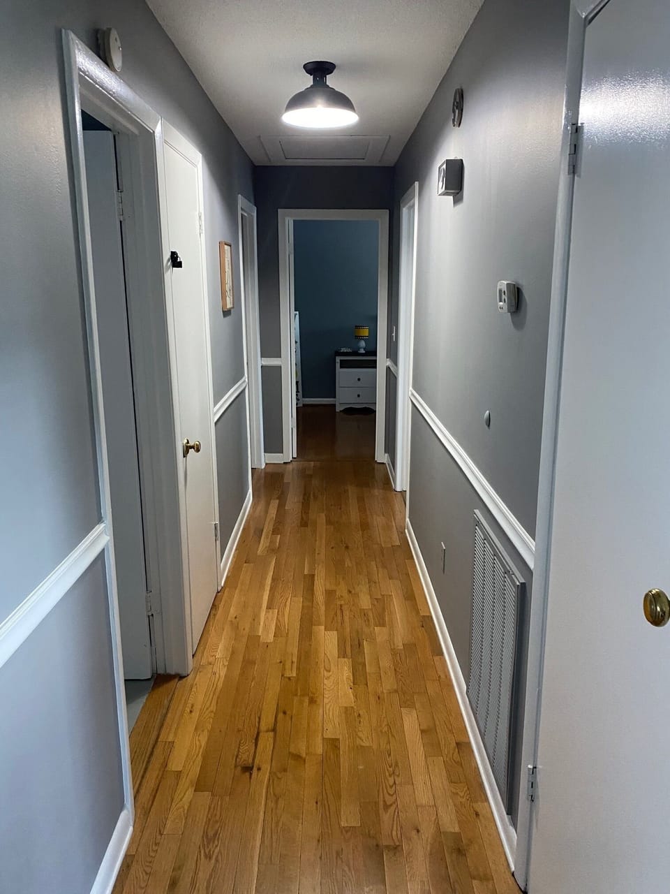 Hallway leading to three upper level bedrooms and hall bath