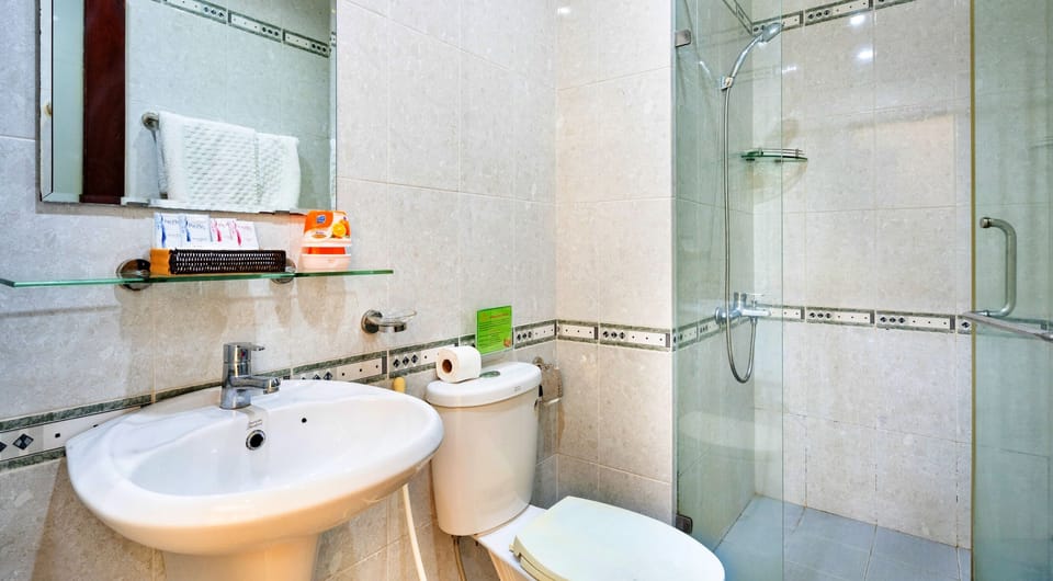 Shower, free toiletries, hair dryer, slippers