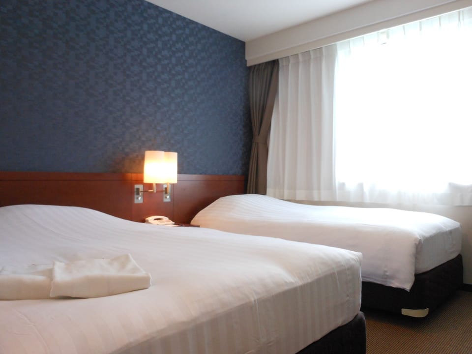 Premium bedding, down comforters, desk, blackout drapes