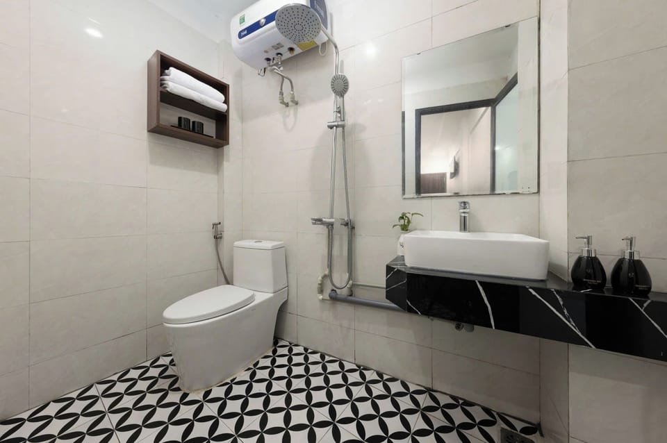 Shower, free toiletries, hair dryer, slippers