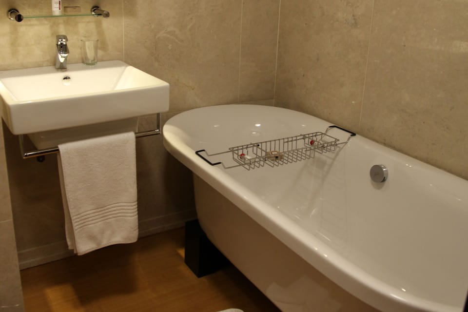 Luxury Suite | Bathroom | Designer toiletries, hair dryer, bathrobes, slippers