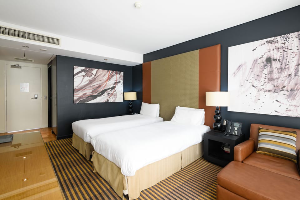 Standard Twin Room | Minibar, in-room safe, desk, iron/ironing board