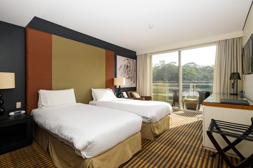 Standard Twin Room | Minibar, in-room safe, desk, iron/ironing board