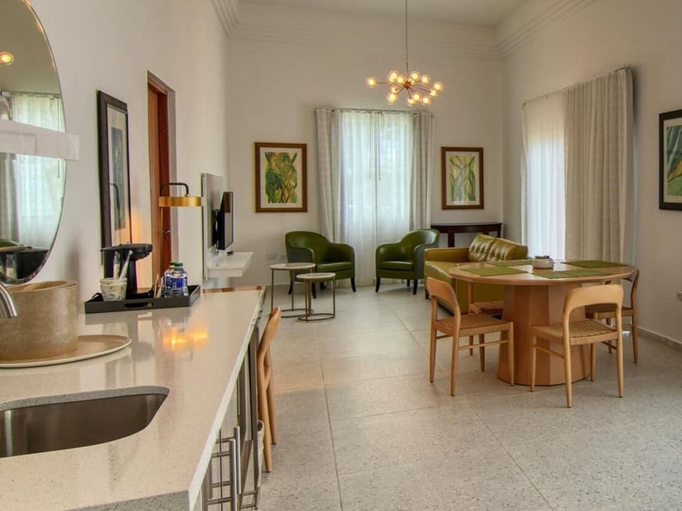 Suite, 1 Bedroom, Kitchenette, Beach View | Living area | 48-inch TV with satellite channels