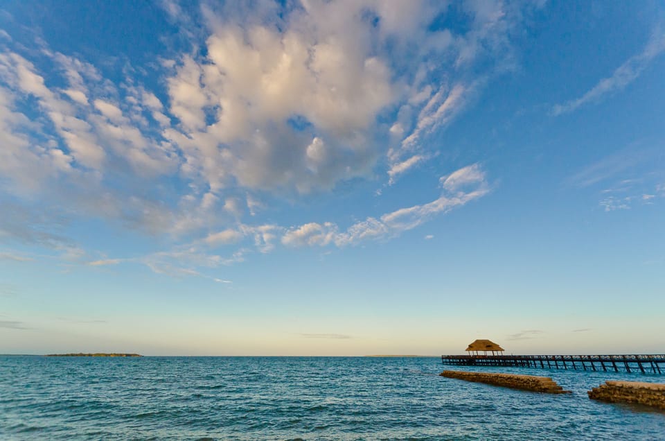 Private beach, white sand, sun loungers, beach umbrellas