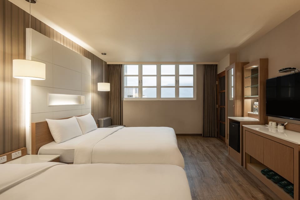 Family Room | Premium bedding, desk, laptop workspace, blackout drapes