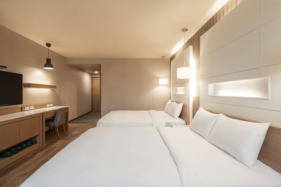 Family Room | Premium bedding, desk, laptop workspace, blackout drapes