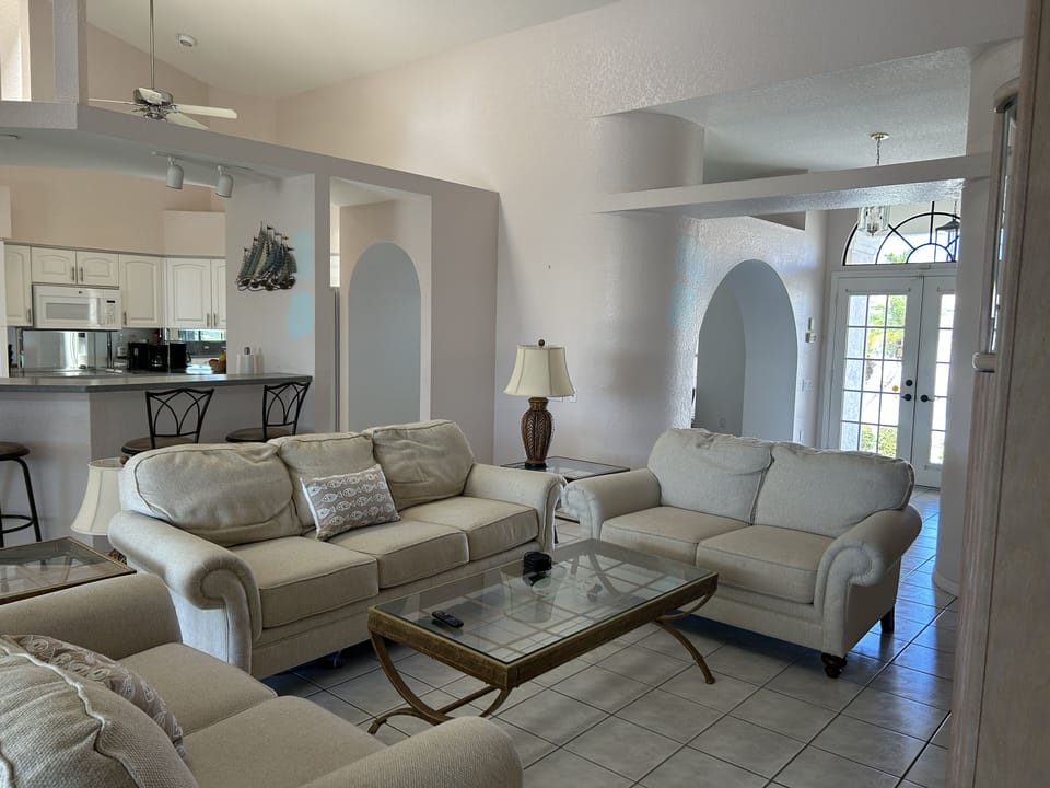 Family room with vaulted ceilings is centrally located