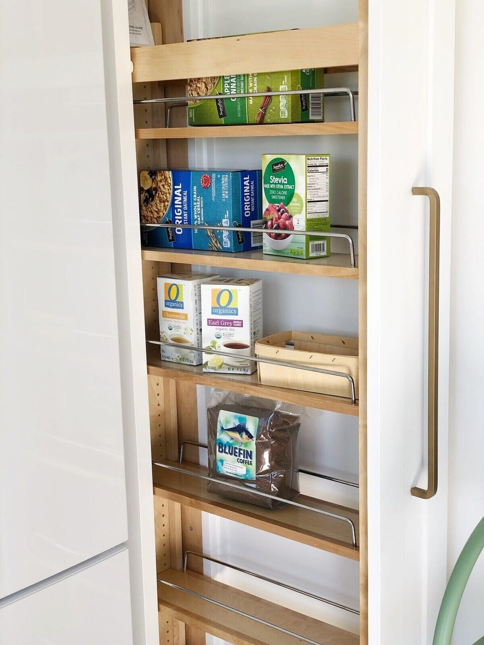 Small pull-out pantry in the kitchen will be stocked with coffee, tea, oatmeal, and other basics.