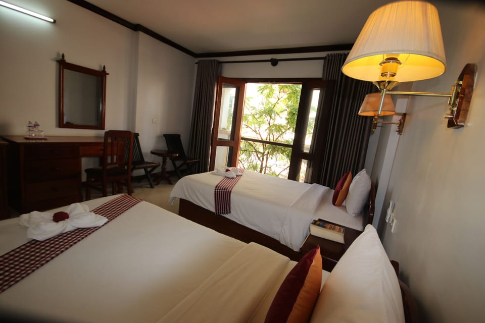 Deluxe Double or Twin Room | Minibar, in-room safe, desk, laptop workspace