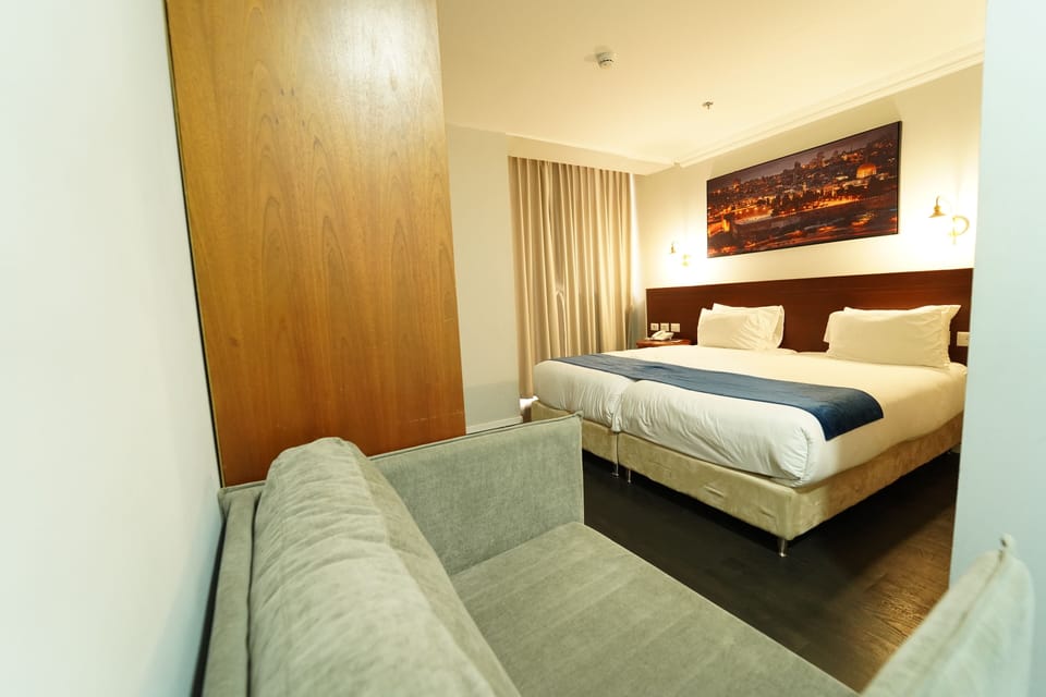 Classic Double or Twin Room | Minibar, in-room safe, desk, iron/ironing board