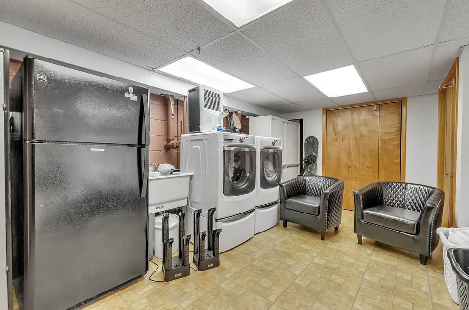 28 Extra large capacity washer & dryer, boot dryers, iron and board,  steamer, detergent provided