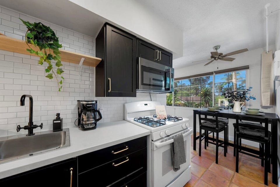 Full Kitchen with Stove, Coffee Pot, and Cooking Essentials