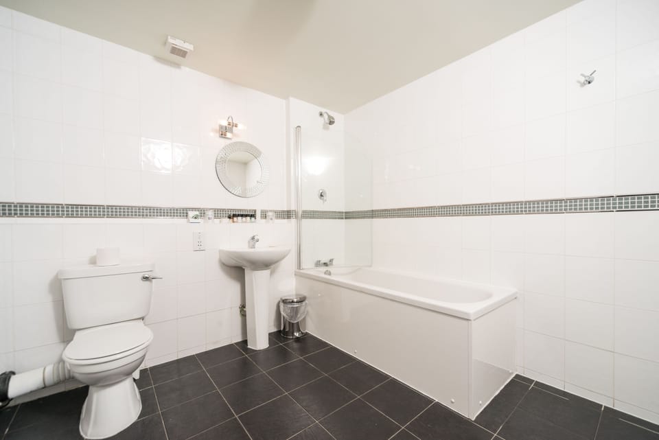 Designer toiletries, hair dryer, towels