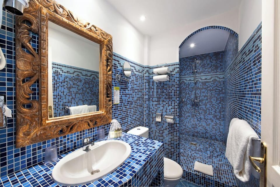 Combined shower/tub, free toiletries, hair dryer, slippers